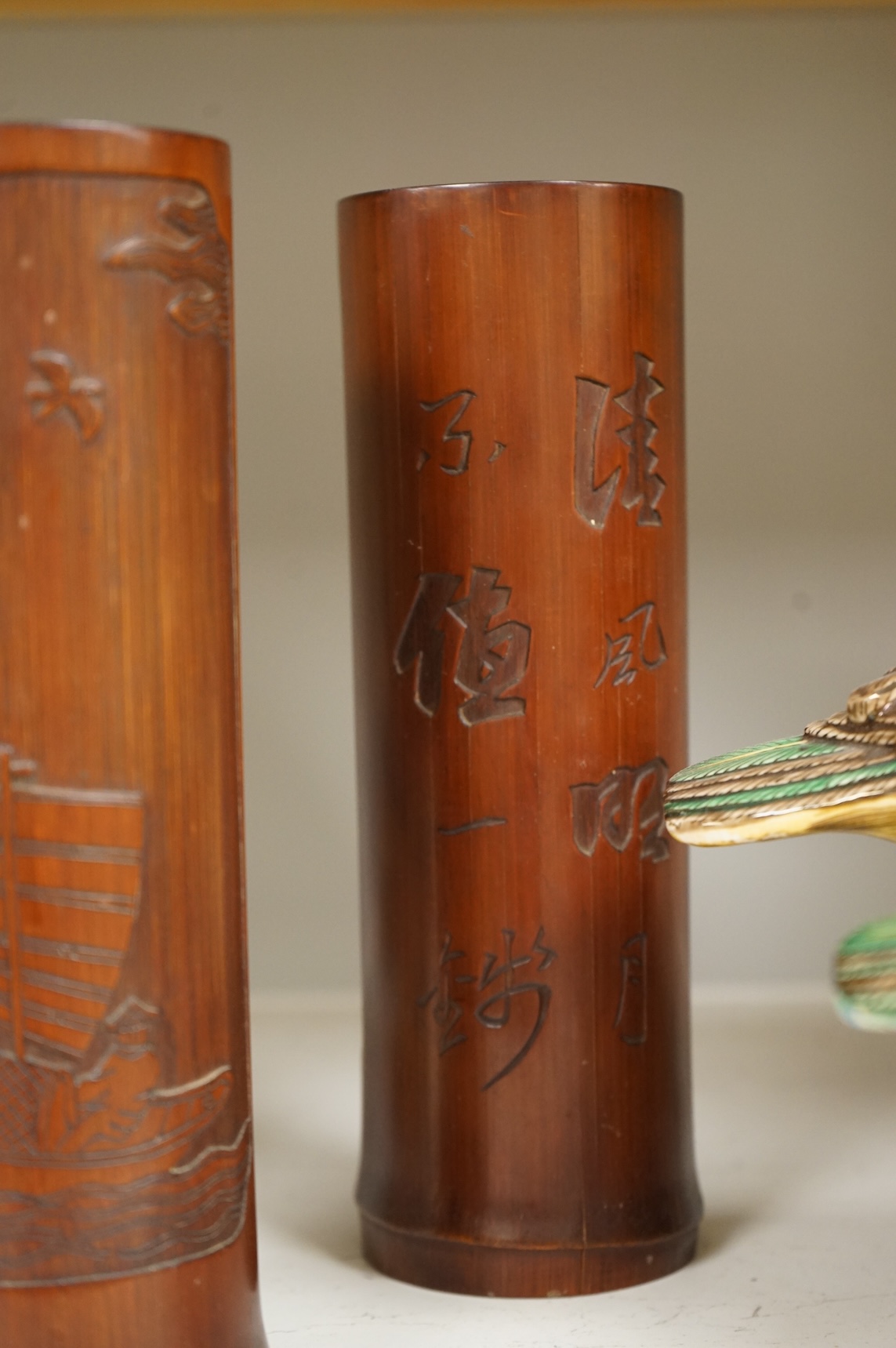 A Chinese Revolution Period porcelain bird group, 21.5cm, a pair of Chinese bamboo brushpots carved with figures and junks, each 22cm high, and a Japanese Seto blue and white vase, 29cm high